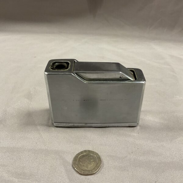 Vintage Panther Regal gas table lighter with polished metal finish.