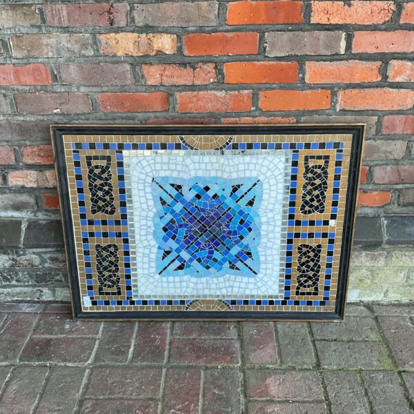 Vintage Roman mosaic wall panel with geometric tile design.