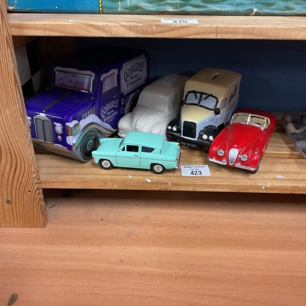 Red Burago diecast model car, vintage style collectible.