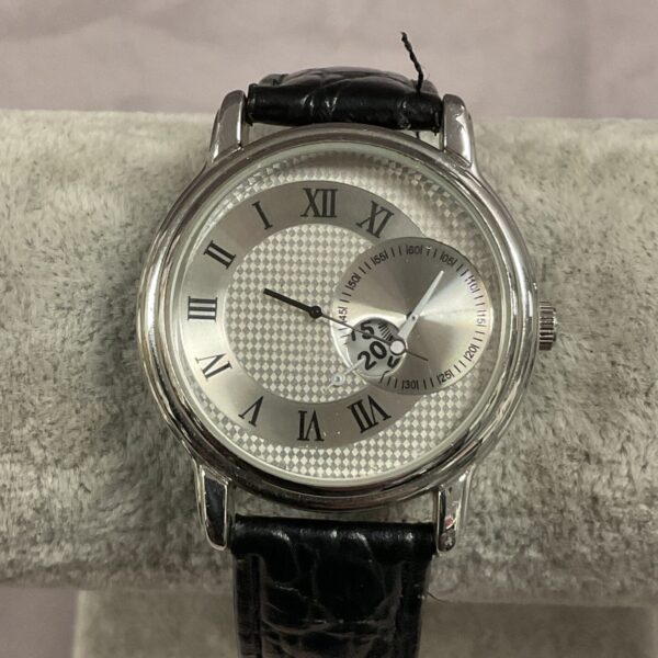 Vintage Japanese wristwatch with unusual reverse dial and Roman numerals.