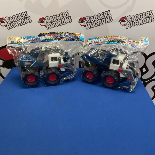 Sealed Japanese construction trucks in original packaging.