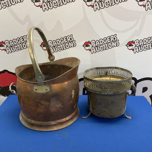 Vintage copper coal scuttle repurposed as a decorative planter.