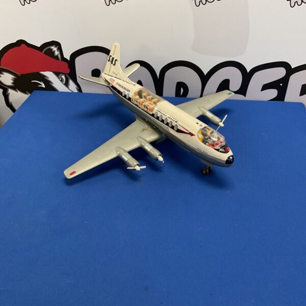 Side view of vintage Scandinavian Airlines tinplate airplane.