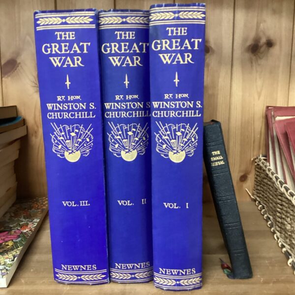 Vintage Winston Churchill books and a small missal collection.
