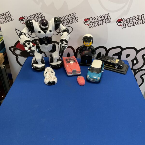 Mixed toy lot including RC car, Lego clock, and diecast Lamborghini.
