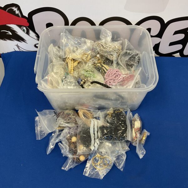 Assorted costume jewellery lot with necklaces, bracelets, and earrings.