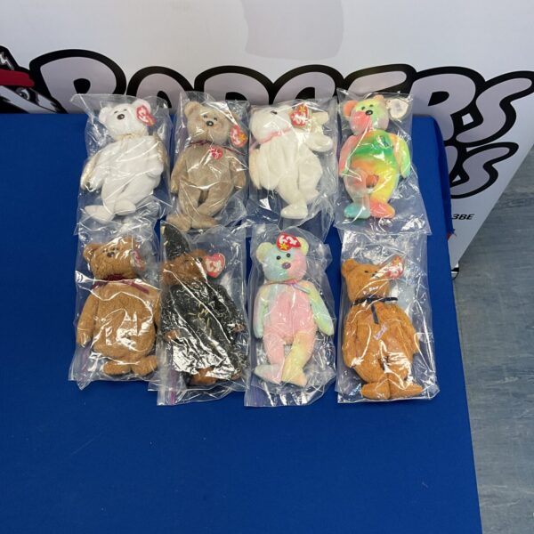 Vintage Ty Beanie Babies lot in plastic bags, collectible plush toys.