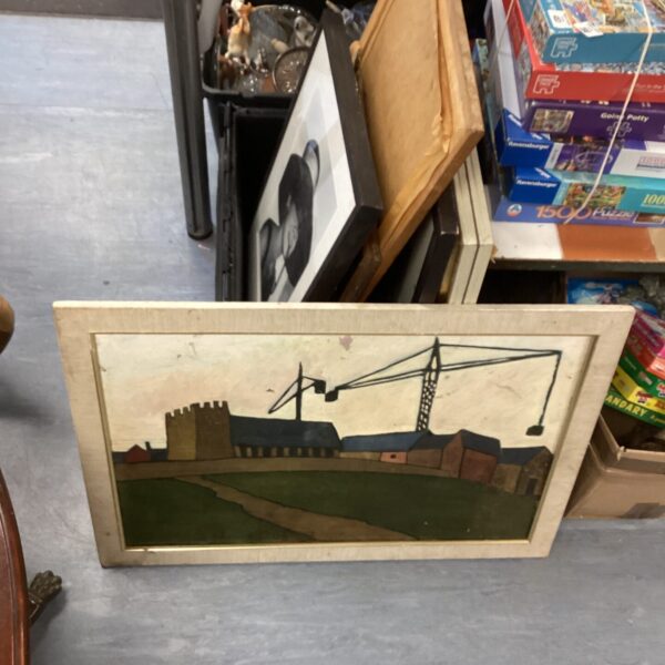 Vintage framed landscape painting with a castle building.