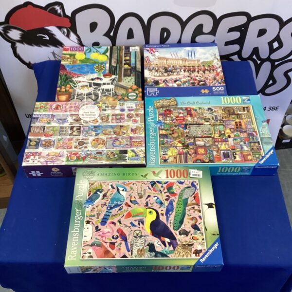 Lot of five jigsaw puzzles including Ravensburger.