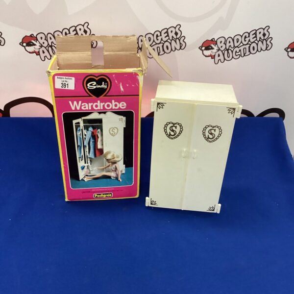 Vintage Sindy wardrobe in original box, collectible doll furniture.
