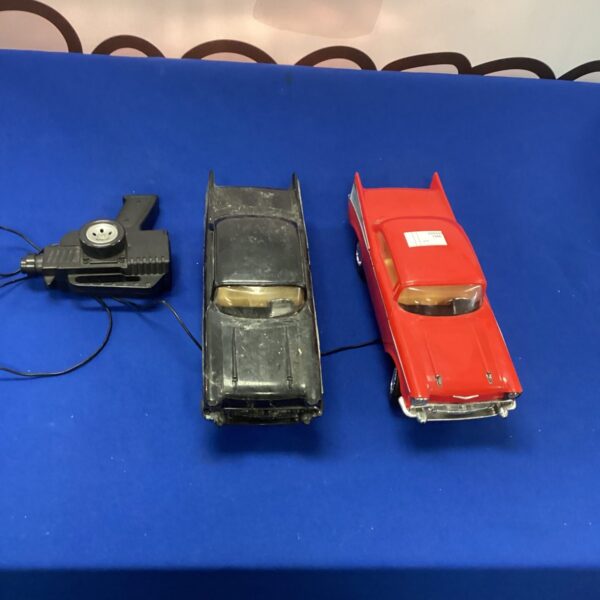 Vintage remote control cars lot with remotes.