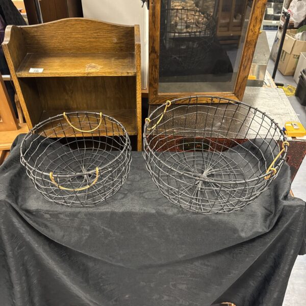 Pair of vintage wire baskets for farmhouse storage and display.