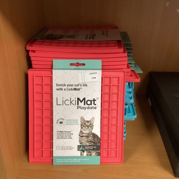 Pink LickiMat Playdate for cat enrichment and slow feeding.
