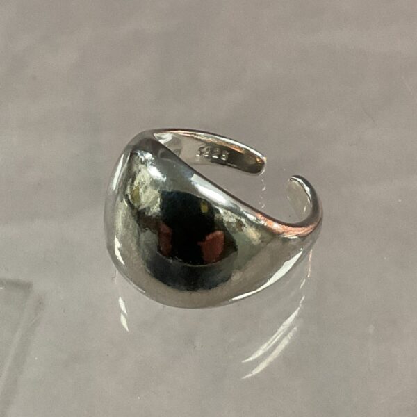 Close-up of a silver band ring, size O.