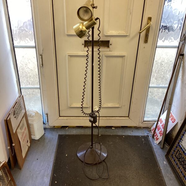 Vintage dual light standard lamp with adjustable heads.