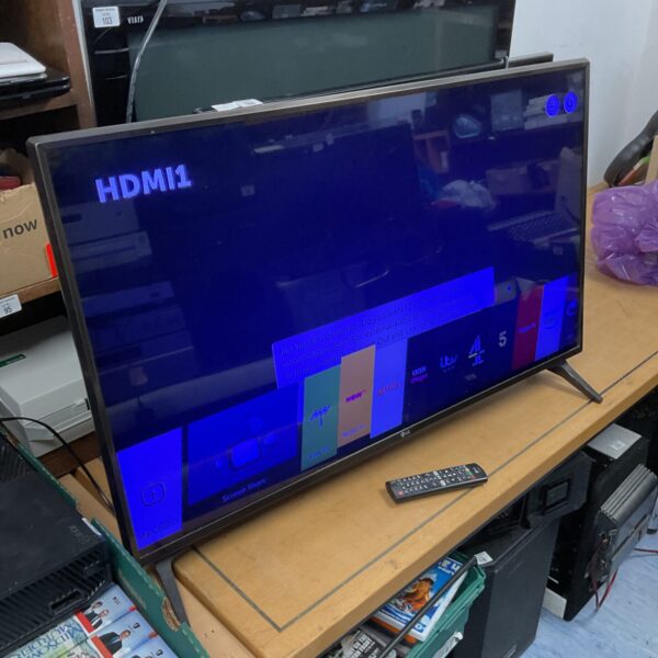 Used LG 43 inch smart TV with remote control for sale.