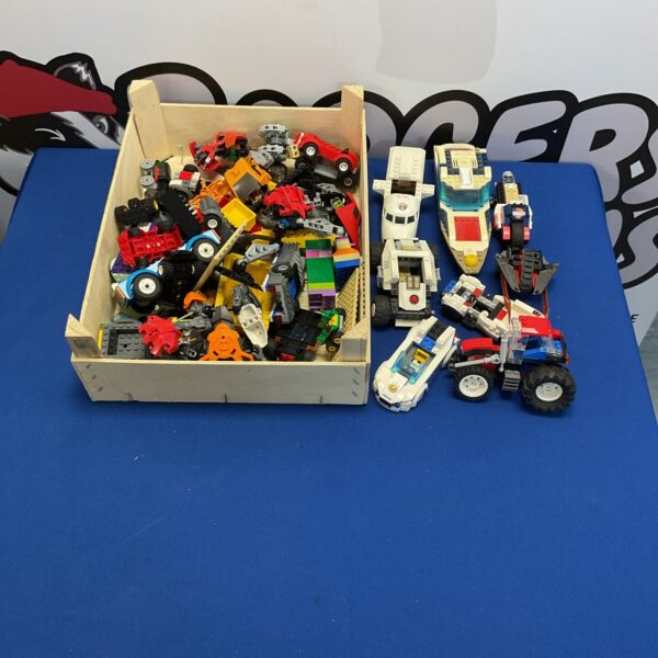 Mixed Lego vehicles and building blocks from various themes.