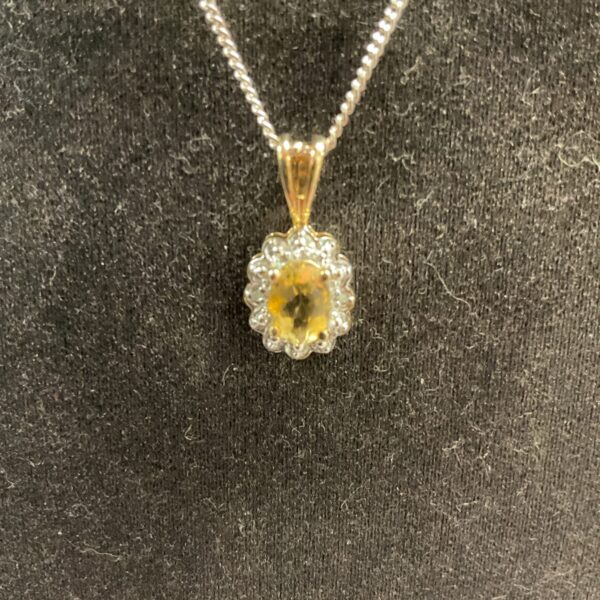 Silver gilt citrine and diamond pendant necklace on a chain.