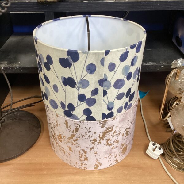 Vintage floral lamp shade with a cream background.