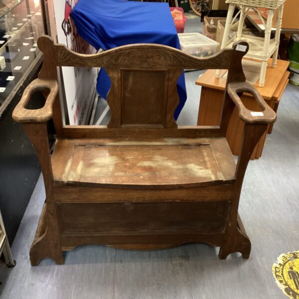 Antique oak hall bench with stick and umbrella stand.