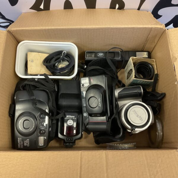 Vintage camera lot featuring Minolta and Nikon film cameras.