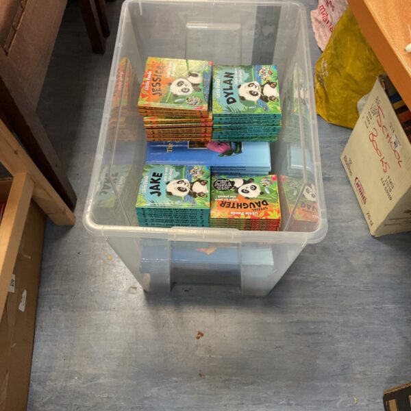 Collection of Disney Wonderful World of Knowledge books in a plastic container.