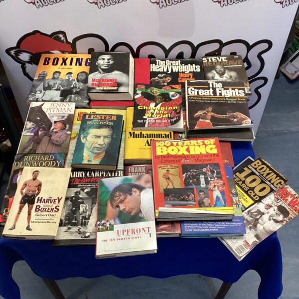 Stack of vintage boxing books including Muhammad Ali biography.