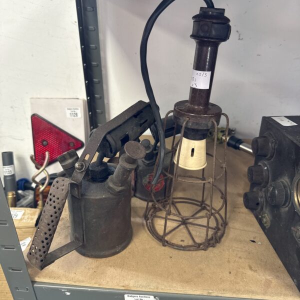 Pair of vintage paraffin torches with Bakelite lamps for garden lighting.