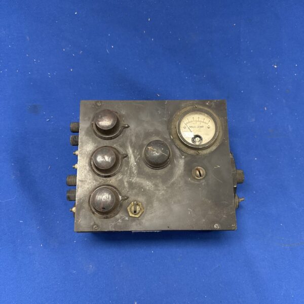Front view of a vintage signal generator with knobs and meter.