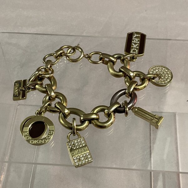 Vintage DKNY charm bracelet in gold tone metal.