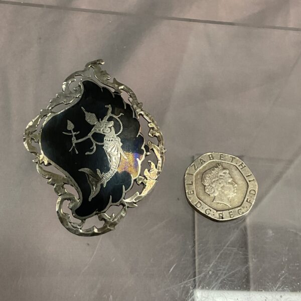 Vintage sterling silver Siamese brooch with detailed figure.