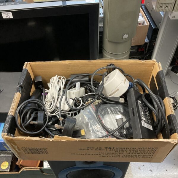 Mixed lot of cables and power supplies for electronics projects.