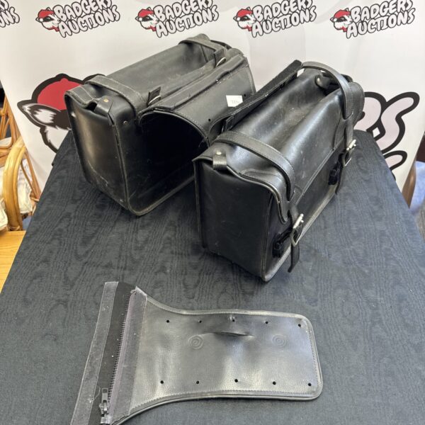 Pair of black SBS motorcycle pannier bags for storage.