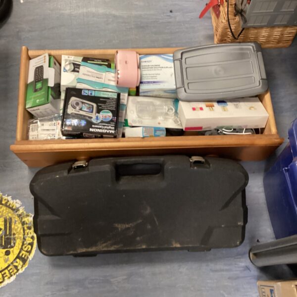 Mixed medicine and tool lot with reciprocating saw and tablets.