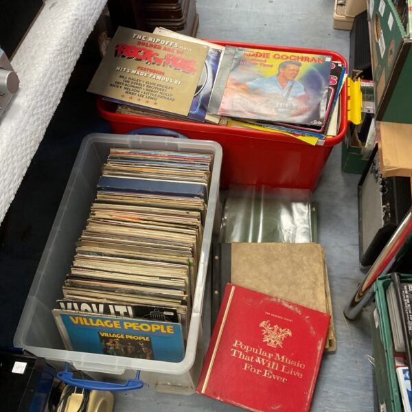 Large lot of vintage vinyl records in cardboard boxes.