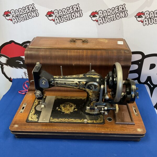 Antique Frister & Rossman sewing machine, vintage collectible with decorative details.