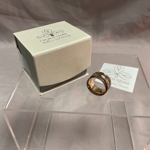 Sterling silver spinner ring size O with energy stone detail.