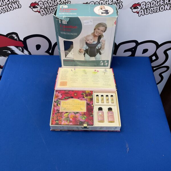 Mothercare baby carrier with aromatherapy gift set, vintage nursery item.