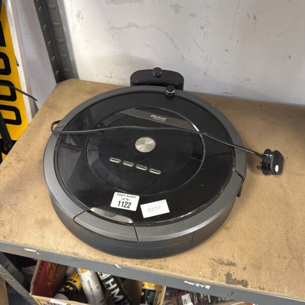 Front view of a black iRobot Roomba vacuum cleaner.