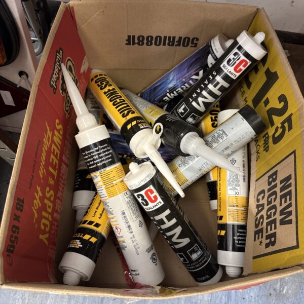 Assorted new sealant tubes for construction and DIY projects.
