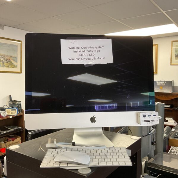 Vintage Apple iMac G3 Bondi Blue computer with keyboard.