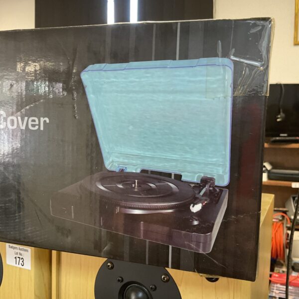 Portable USB turntable with dust cover for vinyl records.