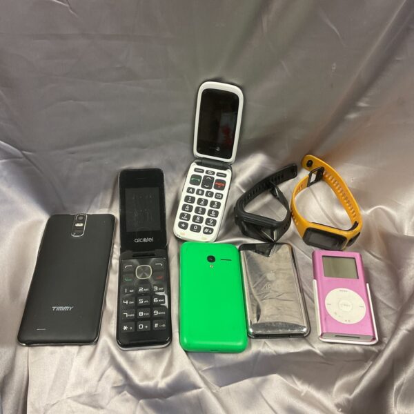 Vintage mobile phone lot with iPod and TomTom watch.