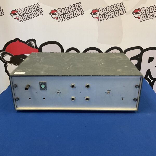 Front view of vintage custom amplifier with metal chassis.