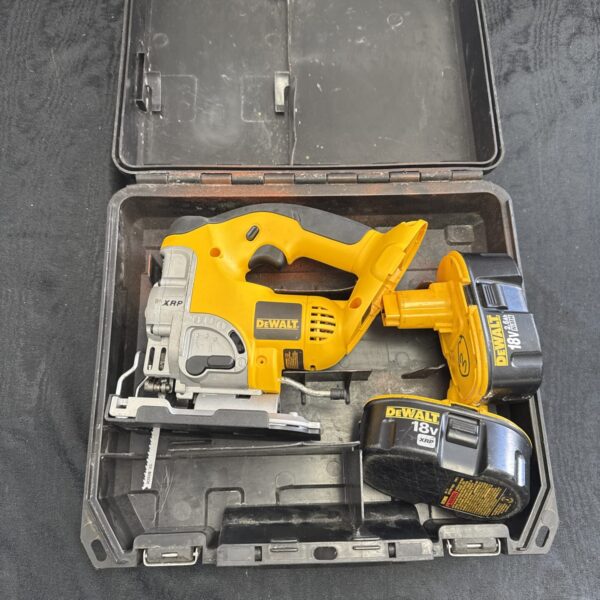 Dewalt XRP cordless jigsaw with batteries, side view.