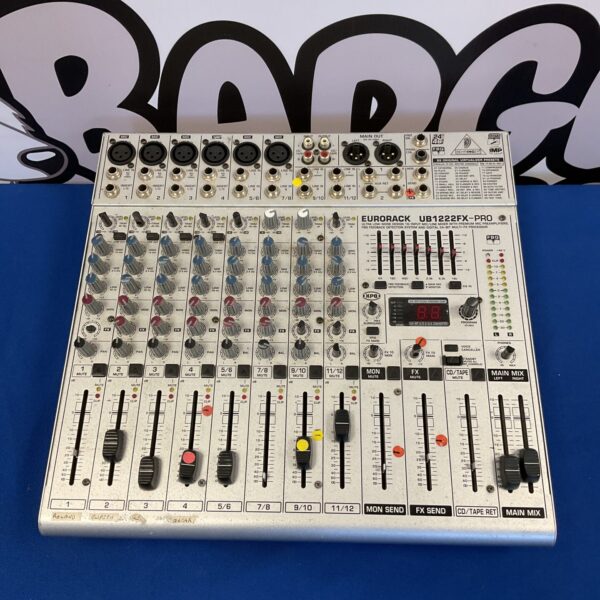 Front view of a Behringer UB1222FX audio mixer with controls visible.