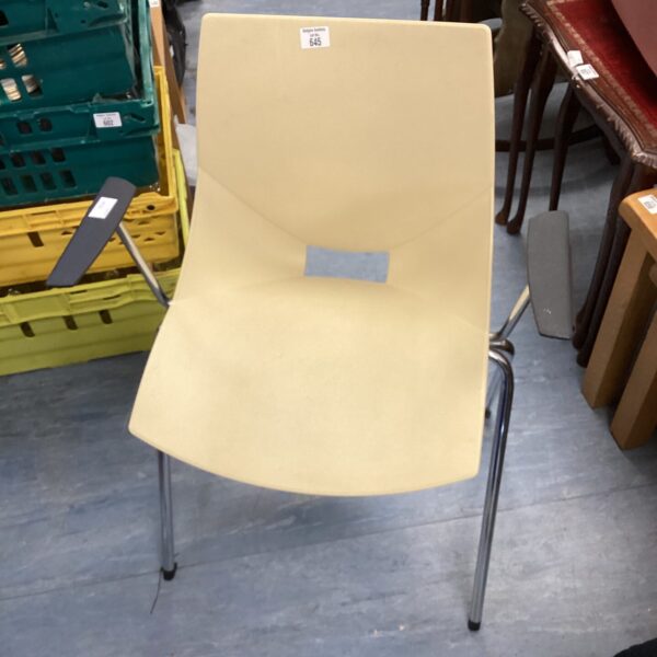 Vintage Peter Horobin chair with beige shell and chrome frame.