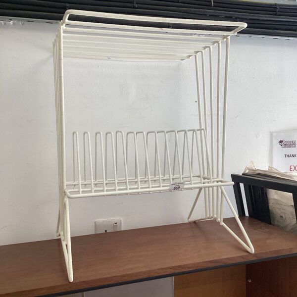 Vintage vinyl record rack for LP storage, retro style.