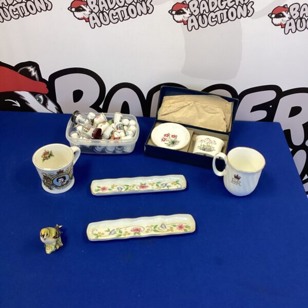 Vintage china thimble collection with decorative patterns.