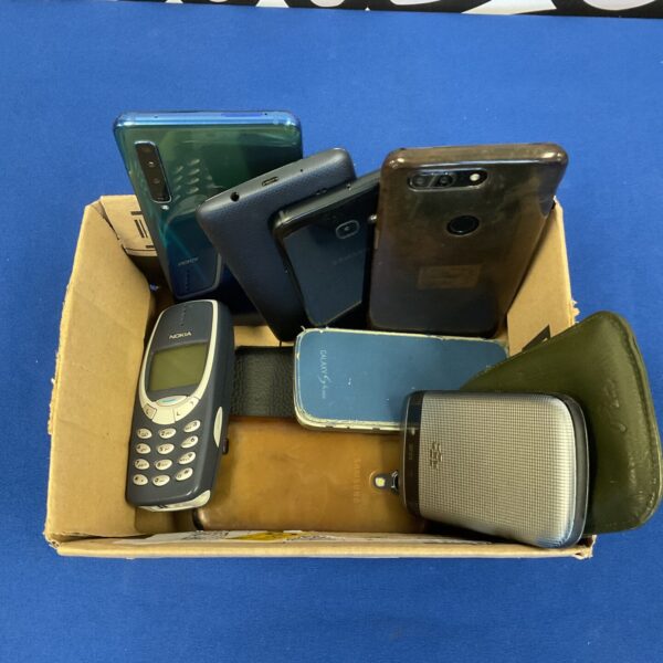 Assorted vintage mobile phones including Nokia and Samsung handsets.